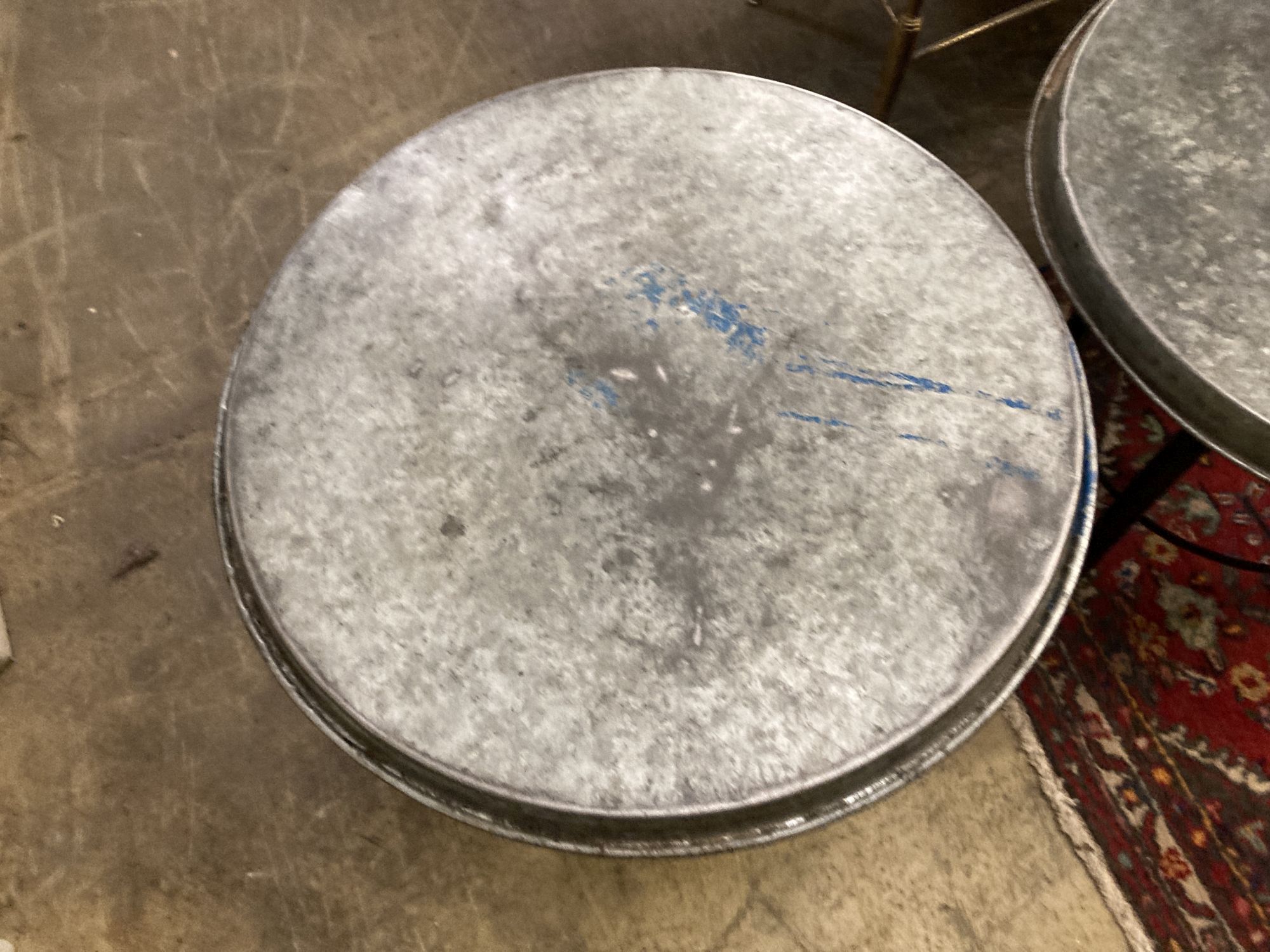 Two industrial style circular metal occasional tables, 54cm diameter, height 44cm